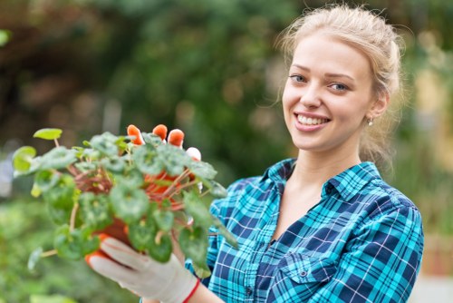 Gardener assessing site with clipboard